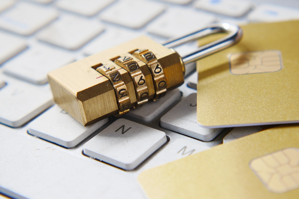 Padlock on a keyboard with credit cards